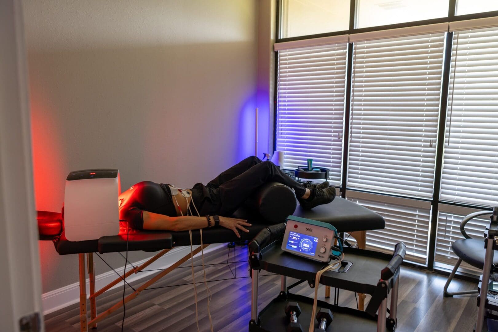 Person receiving red light therapy treatment.